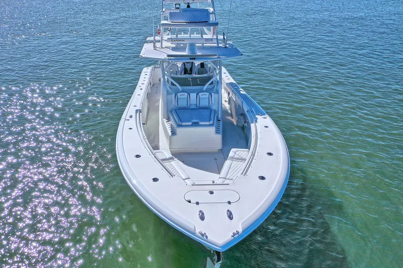Slide: The Image of 2015 Yellowfin 42 Offshore boat on clear blue water, aerial view. - 14