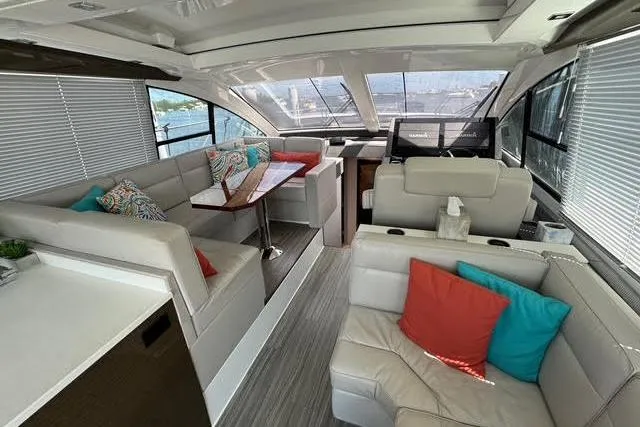 Slide: The Image of Luxurious interior of 2019 Cruisers Yachts 50 Cantius with plush seating and vibrant cushions. - 11