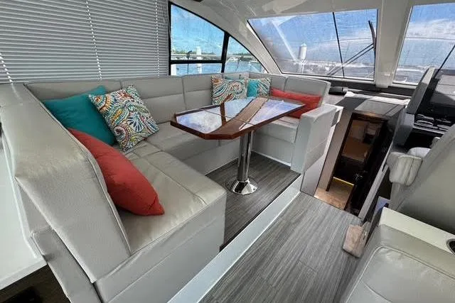 Slide: The Image of Luxurious interior of 2019 Cruisers Yachts 50 Cantius with modern seating and vibrant cushions. - 16
