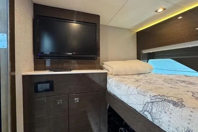 Slide: The Image of 2019 Cruisers Yachts 50 Cantius interior with TV and cozy bed. - 30