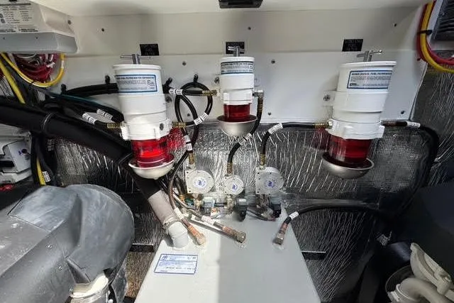 Slide: The Image of Engine room of 2019 Cruisers Yachts 50 Cantius with fuel filters and hoses. - 34