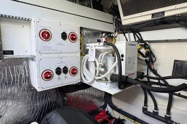 Slide: The Image of Engine room of 2019 Cruisers Yachts 50 Cantius with electrical panels and equipment. - 35