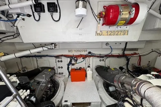 Slide: The Image of Engine room of 2019 Cruisers Yachts 50 Cantius with visible machinery and fire extinguisher. - 36