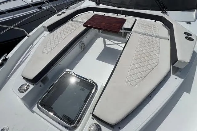 Slide: The Image of 2019 Cruisers Yachts 50 Cantius deck with cushioned seating and table. - 4