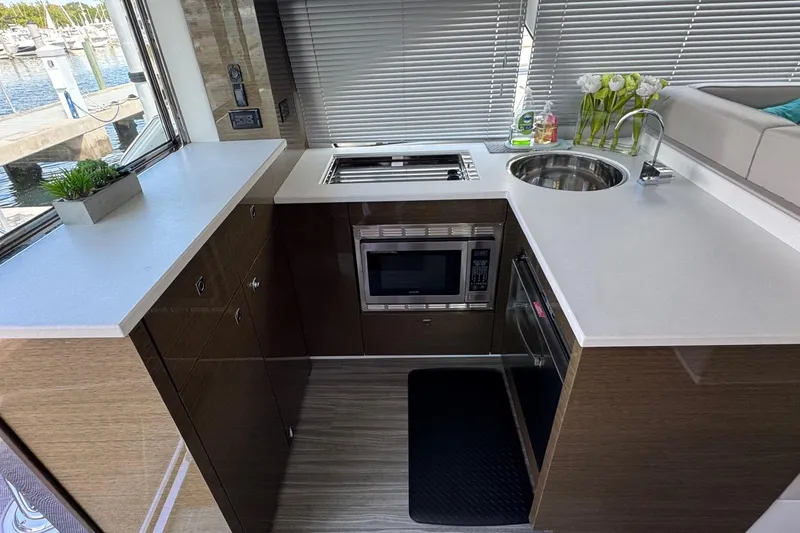 Slide: The Image of Modern kitchen in 2019 Cruisers Yachts 50 Cantius with sleek countertops and appliances. - 15