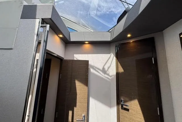 Slide: The Image of 2019 Cruisers Yachts 50 Cantius interior with skylight and modern wooden doors. - 19
