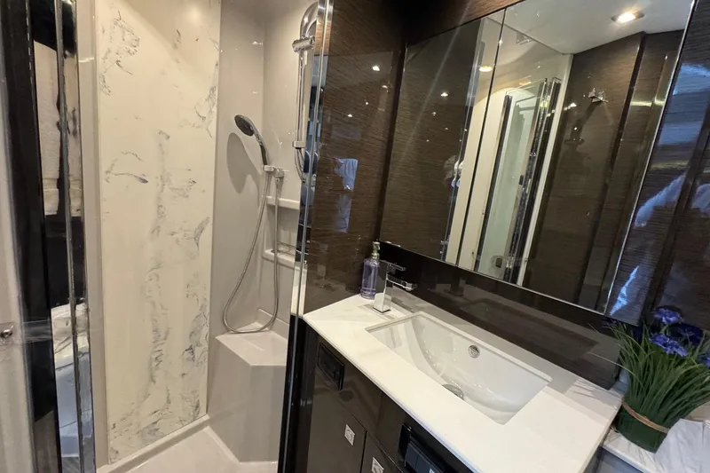 Slide: The Image of Luxurious bathroom in 2019 Cruisers Yachts 50 Cantius with modern fixtures and elegant design. - 24