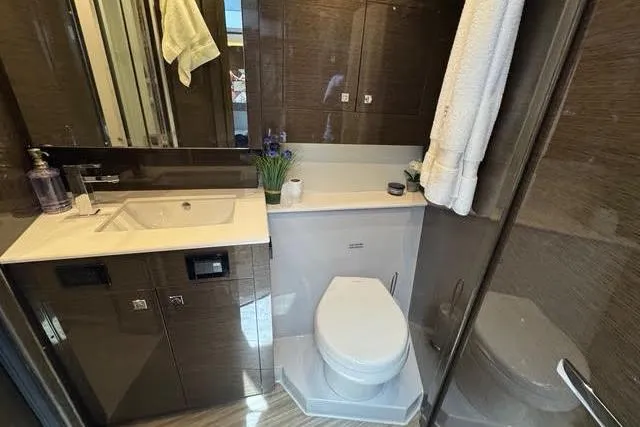 Slide: The Image of Luxurious bathroom in 2019 Cruisers Yachts 50 Cantius with modern fixtures and elegant design. - 28