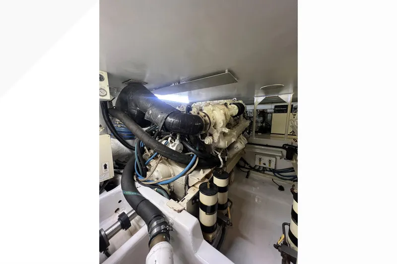 Slide: The Image of Engine room of 1999 Viking 60 CPMY yacht, showcasing machinery and components. - 119