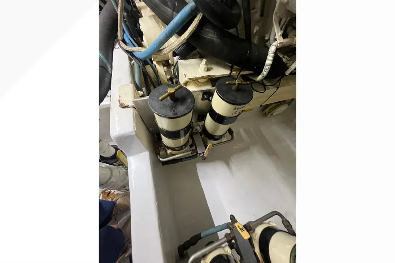 Slide: The Image of Engine room of 1999 Viking 60 CPMY yacht with fuel filters and hoses. - 122