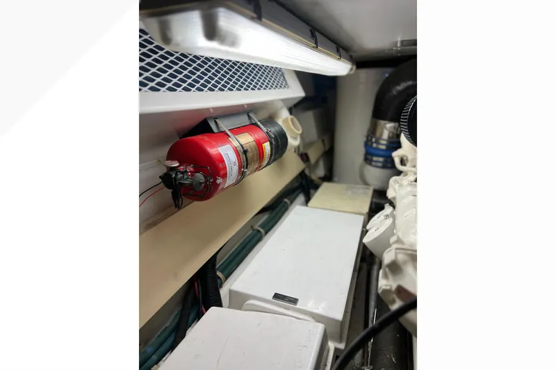 Slide: The Image of Engine room of 1999 Viking 60 CPMY with fire extinguisher and ventilation system. - 149