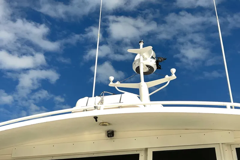 Slide: The Image of 1999 Viking 60 CPMY yacht radar against a blue sky with clouds. - 22
