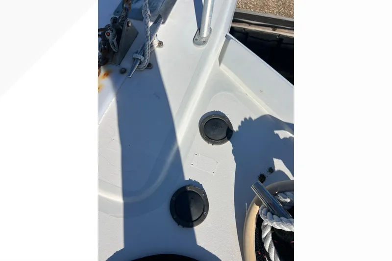 Slide: The Image of Deck view of a 1999 Viking 60 CPMY yacht with ropes and fittings. - 28