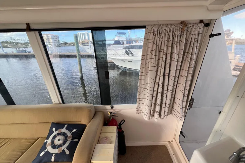 Slide: The Image of Interior view of 1999 Viking 60 CPMY yacht with waterfront scenery. - 34