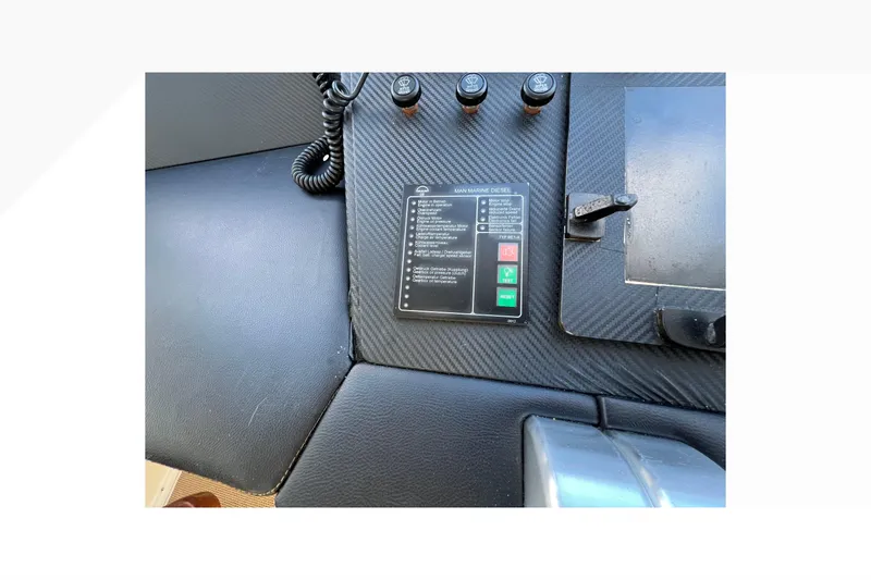 Slide: The Image of Control panel of a 1999 Viking 60 CPMY yacht with carbon fiber finish. - 47