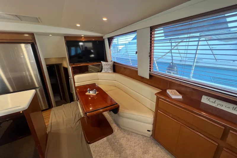 Slide: The Image of Luxurious interior of 1999 Viking 60 CPMY yacht with leather seating and modern amenities. - 64