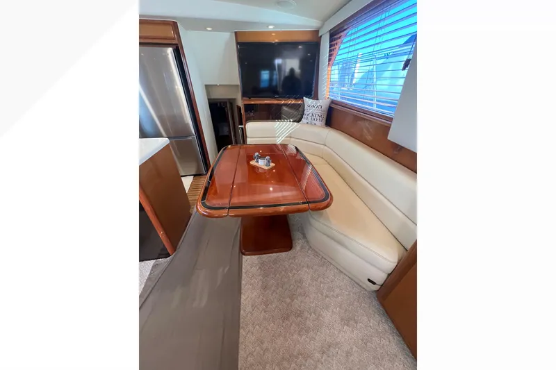 Slide: The Image of Luxurious interior of 1999 Viking 60 CPMY yacht with elegant dining area. - 65