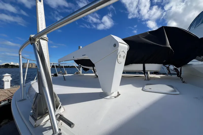 Slide: The Image of 1999 Viking 60 CPMY yacht deck with clear sky and waterfront view. - 7