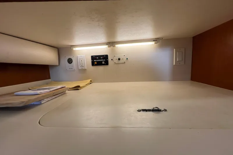 Slide: The Image of 1999 Viking 60 CPMY yacht interior with control panel and under-cabinet lighting. - 73