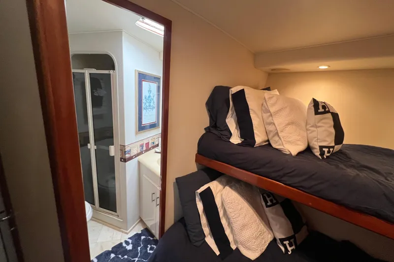 Slide: The Image of Cozy cabin with bunk beds and bathroom in 1999 Viking 60 CPMY yacht. - 79