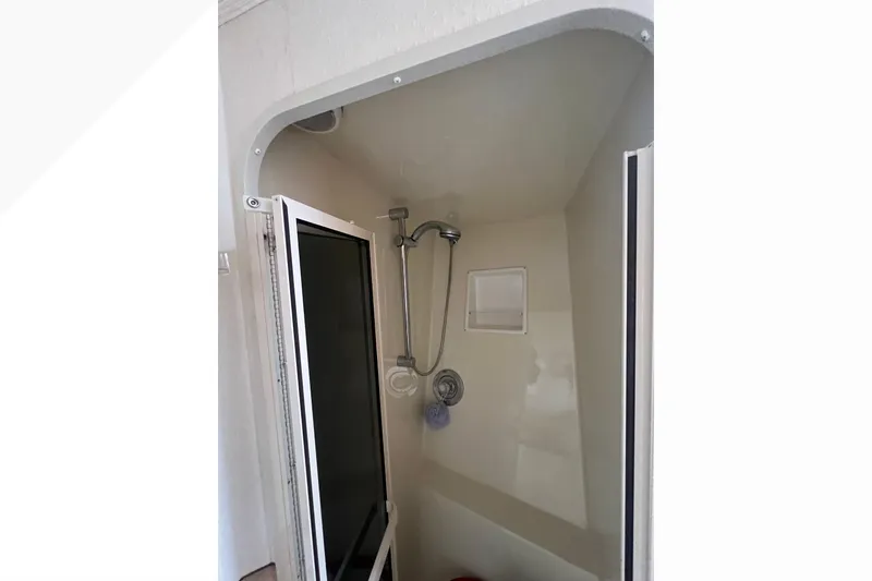 Slide: The Image of Shower area inside 1999 Viking 60 CPMY yacht, featuring a compact design. - 88
