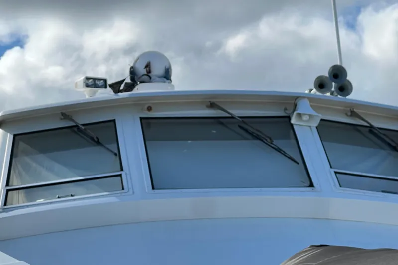 Slide: The Image of Close-up of 1999 Viking 60 CPMY yacht's bridge with windows and radar equipment. - 9