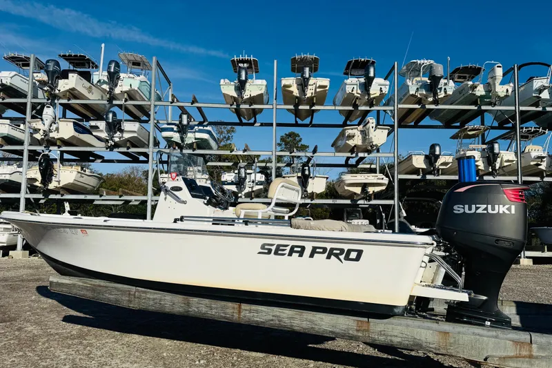 The Image of 2017 Sea Pro 208 Bay boat with Suzuki engine, stored in a multi-level marina. - 1