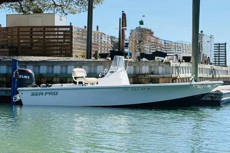 Slide: The Image of 2017 Sea Pro 208 Bay boat docked, featuring Suzuki outboard motor. - 12