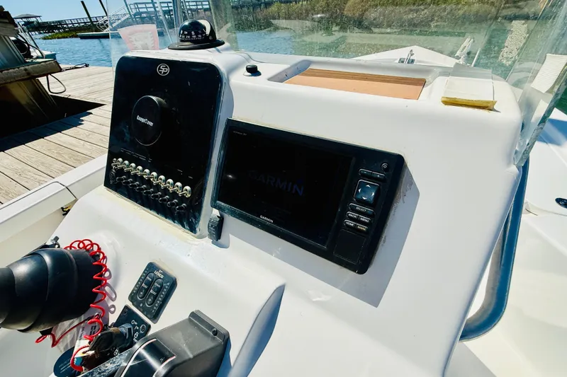 Slide: The Image of 2017 Sea Pro 208 Bay boat console with Garmin navigation system at dock. - 13