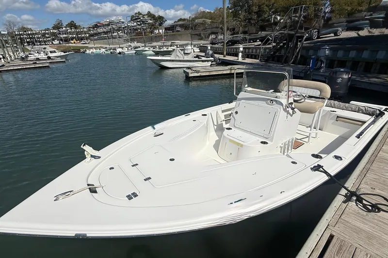 Slide: The Image of 2017 Sea Pro 208 Bay boat docked in a marina under a clear blue sky. - 14