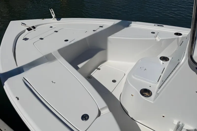 Slide: The Image of 2017 Sea Pro 208 Bay boat deck with storage compartments and cup holders. - 16