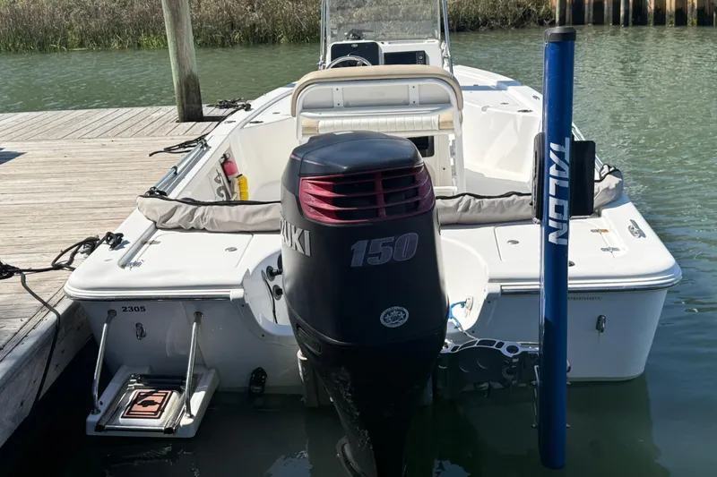 Slide: The Image of 2017 Sea Pro 208 Bay boat docked with Suzuki 150 engine. - 18