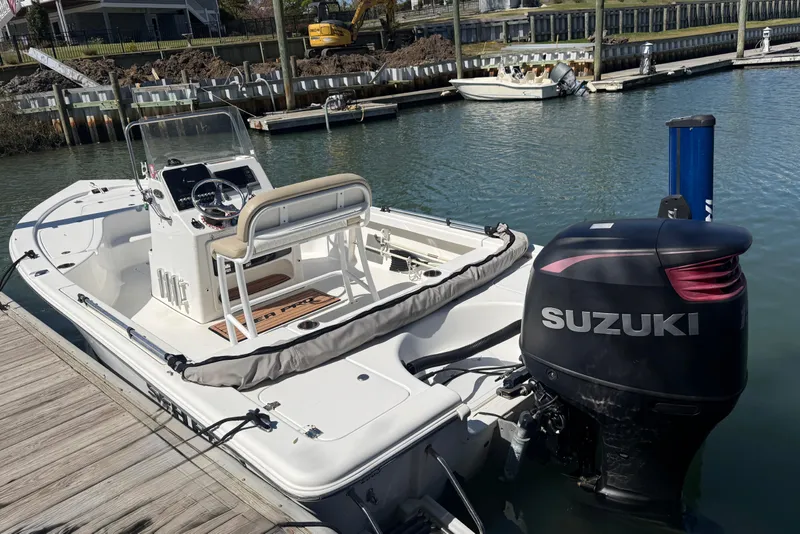 Slide: The Image of 2017 Sea Pro 208 Bay boat with Suzuki outboard motor docked in marina. - 19