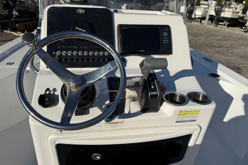 Slide: The Image of 2017 Sea Pro 208 Bay boat console with steering wheel and controls. - 4
