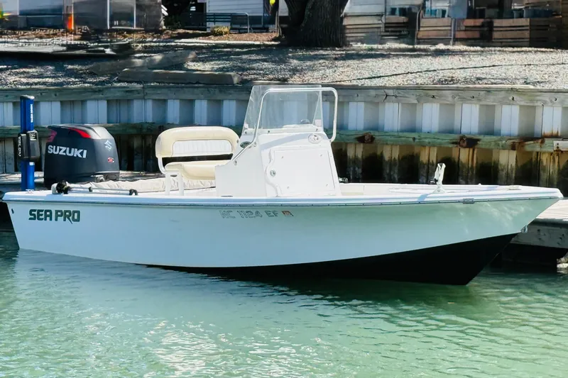 The Image of 2017 Sea Pro 208 Bay boat docked, featuring Suzuki outboard motor. - 9