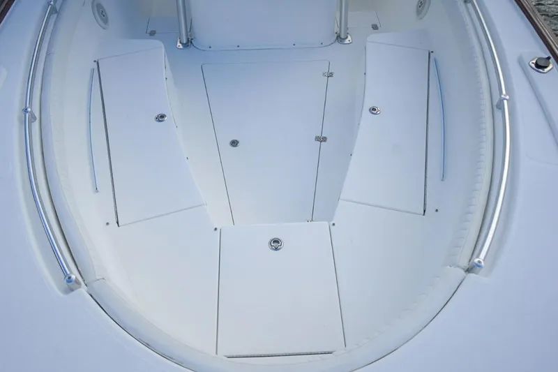 Slide: The Image of 2008 Buddy Davis 28 Center Console boat deck with storage compartments. - 17