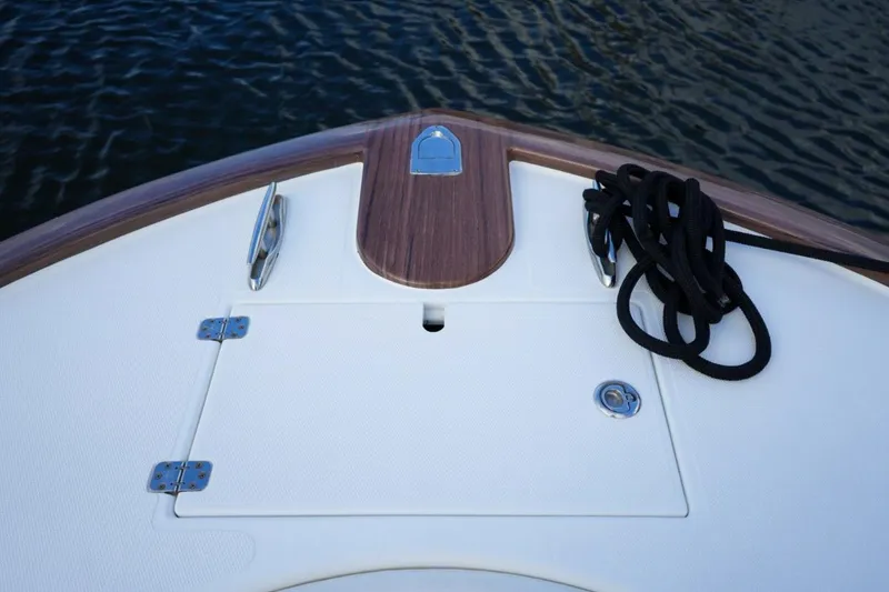 Slide: The Image of 2008 Buddy Davis 28 Center Console boat deck with rope and cleats. - 18