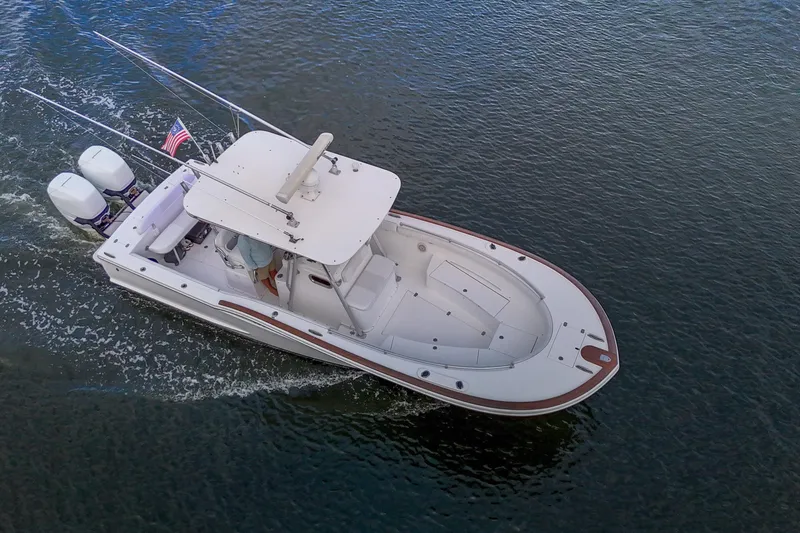 Slide: The Image of 2008 Buddy Davis 28 Center Console boat cruising on water, aerial view. - 24