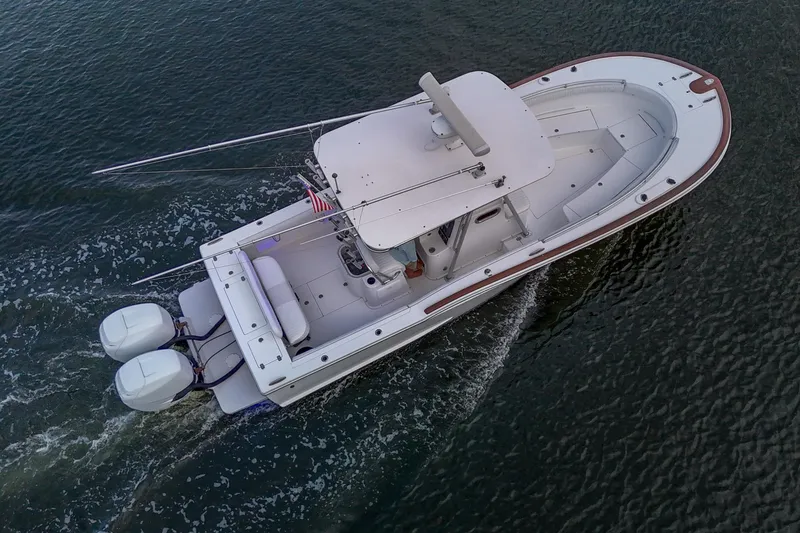 Slide: The Image of Aerial view of 2008 Buddy Davis 28 Center Console boat cruising on water. - 25