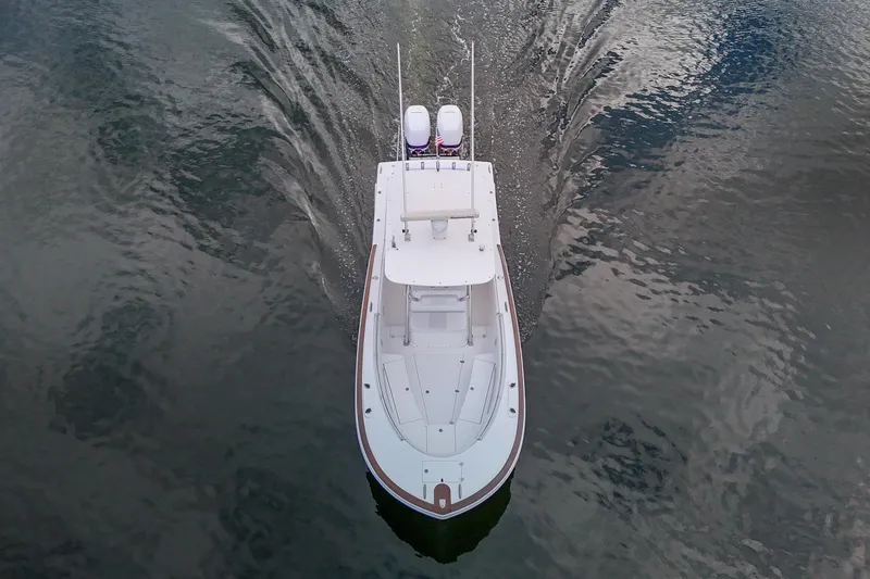 Slide: The Image of Aerial view of 2008 Buddy Davis 28 Center Console boat cruising on water. - 26