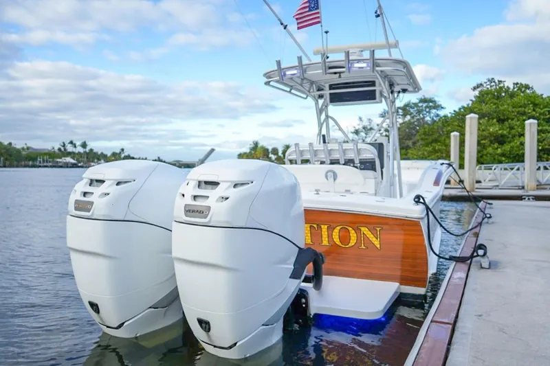Slide: The Image of 2008 Buddy Davis 28 Center Console boat docked with dual outboard engines. - 5