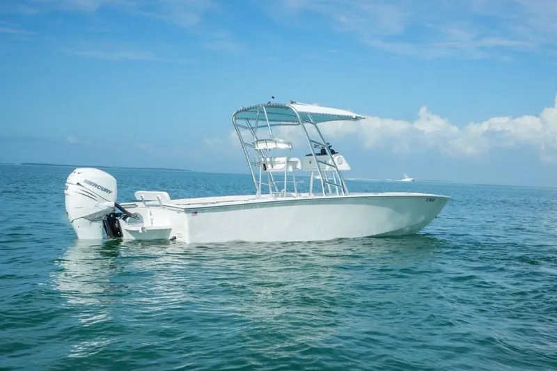 Slide: The Image of 2016 Rambo 27 boat on calm ocean waters under clear blue sky. - 10