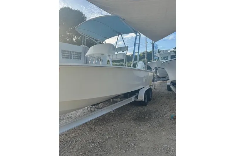 Slide: The Image of 2016 Rambo 27 boat on trailer under canopy, side view. - 19