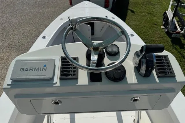 Slide: The Image of Steering console of 2016 Rambo 27 boat with Garmin navigation system. - 26