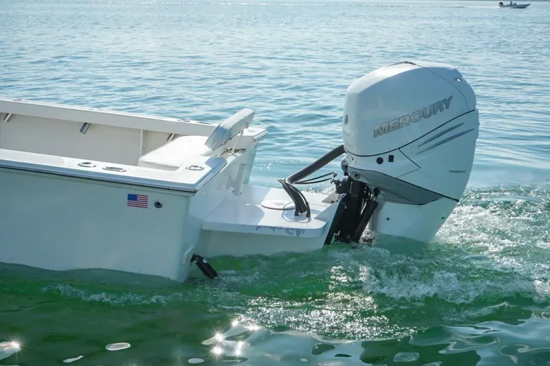 Slide: The Image of Rambo 27 boat (2016) with Mercury outboard motor on calm water. - 5