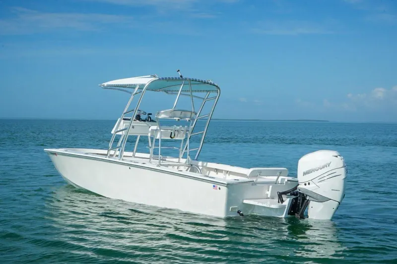 Slide: The Image of 2016 Rambo 27 boat with Mercury engine on calm ocean waters. - 6