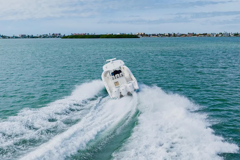 Slide: The Image of 2017 Cobia 344 Center Console boat cruising on open water. - 18