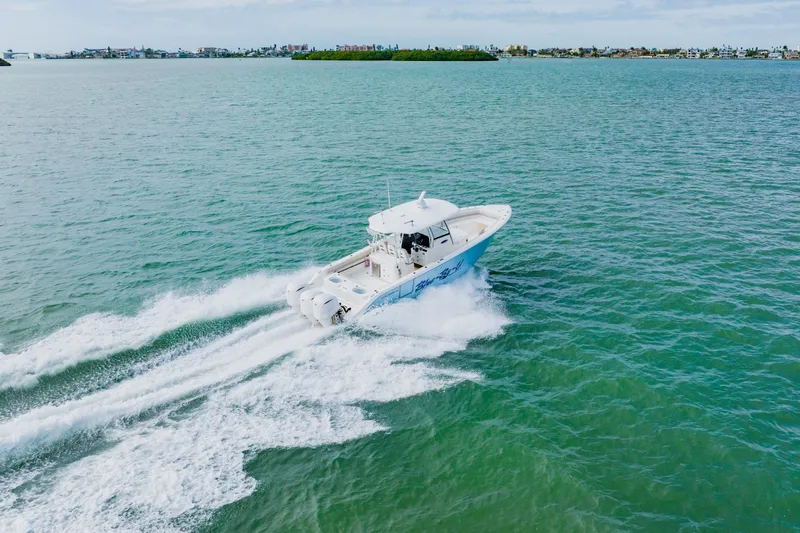 Slide: The Image of 2017 Cobia 344 Center Console boat cruising on open water. - 21