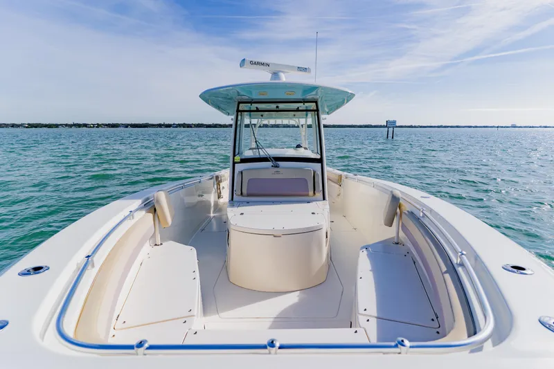 Slide: The Image of 2017 Cobia 344 Center Console boat on open water, clear sky. - 29