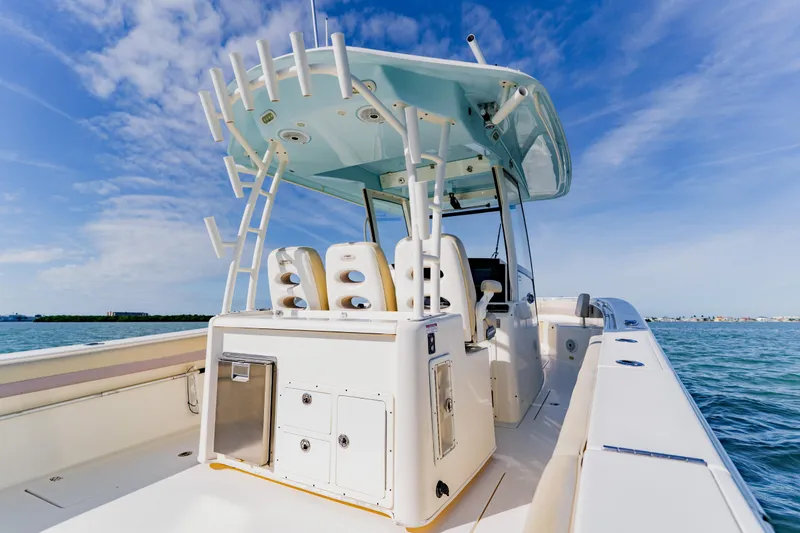 Slide: The Image of 2017 Cobia 344 Center Console boat on open water under blue sky. - 36